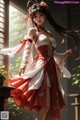 A woman in a red and white dress standing in front of a window.